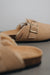Close up on buckle and texture of the sheepskin