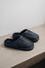 Navy merino sheepskin men's mule slippers with a denim exterior.