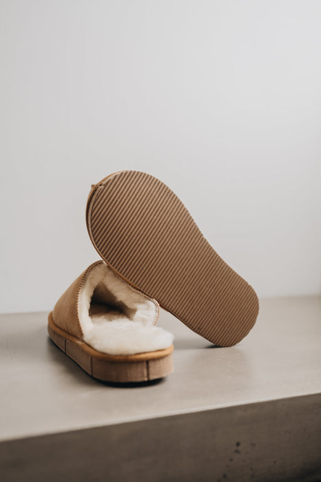 Tan merino sheepskin men's mule slippers with a PVA hard sole