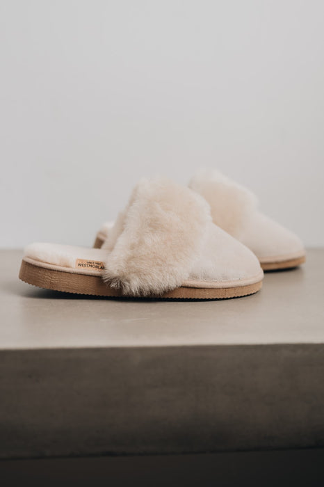 Shearling Sheepskin Slipper For Women Backless Mules - Side view of Veronica Vanilla Sheepskin Slippers on Concrete Surface