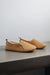 Side view of Grace - a light soft-soled sheepskin slipper, that is handcrafted in Europe from the highest grade of premium Spanish merino sheepskin.