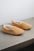 Side view of Grace - a light soft-soled sheepskin slipper, that is handcrafted in Europe from the highest grade of premium Spanish merino sheepskin.