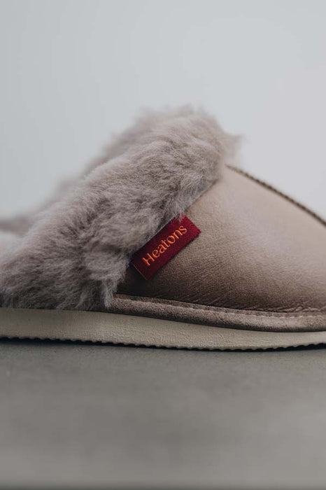 Close up View of Gwen Walnut Sheepskin Slippers with Heatons label detail on Concrete Surface