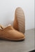 Close up of Tan coloured ankle-high sheepskin slipper showing the ribbed underside of the PVA sole