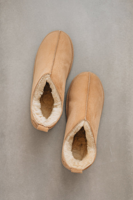 Birds eye view of Hetty ankle-high sheepskin slipper showing plush natural sheepskin wool inside