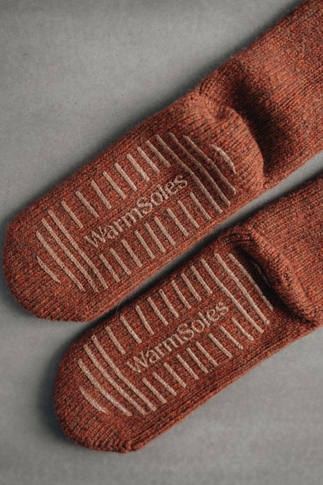Wool Slipper or Bed Socks  with 'warmSole' branding on a gray background