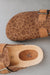Close up on giraffe pattern on the lyra Sahara as well as its adjustable strap and foot bed detailing  