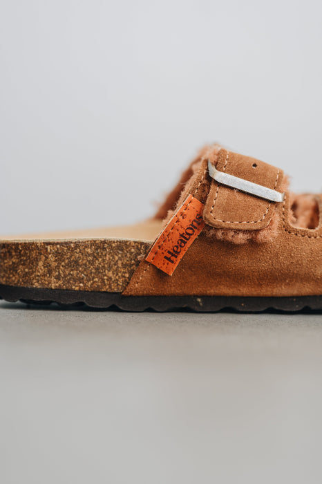 Close up on side profile of the sandals with cork souls and rust dyed sheepskin 