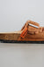 Close up on side profile of the sandals with cork souls and rust dyed sheepskin 