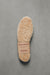 WarmSoles sheepskin footbed on a gray background