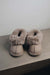 Front View of Ruby Stone Sheepskin Slippers on Concrete Surface