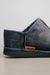 Close up of the heel of a Mens Sheepskin Slipper with Denim Exterior with orange cork Heatons brand label. for durability.