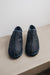 Front view detailing the toe posts of the Cadi Mens Sheepskin Slipper with Denim Exterior for durability. 