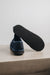 Mens Sheepskin Slipper with Denim Exterior for durability. View of the heel and EVA ribbed sole.