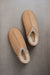 Birds Eye View of Cadi Mel Sheepskin Slippers on Concrete Surface