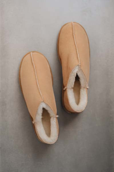 Birds eye view of Cadi Tabac Womens Sheepskin Slippers on a Concrete Surface