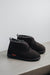 Side view of Veronica dark brown Sheepskin Slippers on Concrete Surface