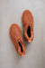 Birds eye view of Henry ankle-high sheepskin slipper showing plush natural sheepskin wool inside
