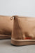 Close up view of Noah Tabac Sheepskin Slippers with Heatons label detail on Concrete Surface