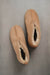 Birds eye view of Noah Tabac Sheepskin Slippers on Concrete Surface