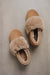 Birds eye view of Margot Taupe Sheepskin Slippers on Concrete Surface