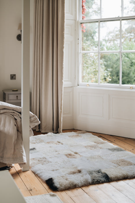 sheepskin rug with grey beige and white patchwork 