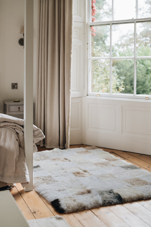sheepskin rug with grey beige and white patchwork 