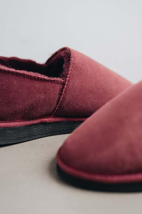 Close up of Bordeaux coloured loafer style sheepskin slipper