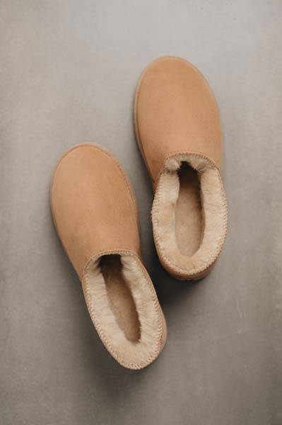 Birds eye view of Tilly tan sheepskin slipper showing plush natural sheepskin  wool inside