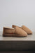 Side view of clean loafer style sheepskin slipper, hand crafted from Spanish merino sheepskin.