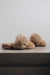 Side view of Veronica Taupe Sheepskin Slippers on Concrete Surface