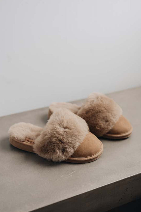 Side view of Veronica Taupe Sheepskin Slippers on Concrete Surface