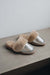 Side view of Veronica Titanium Sheepskin Slippers on Concrete Surface