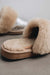 Close up view of Veronica Titanium Sheepskin Slippers with Heatons label detail on Concrete Surface