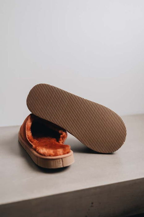 Bottom view showing the sole of the rust coloured women's sheepskin mule slipper called Willow.