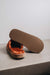 Bottom view showing the sole of the rust coloured women's sheepskin mule slipper called Willow.