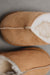 Close up of tan coloured slip on style sheepskin slipper 